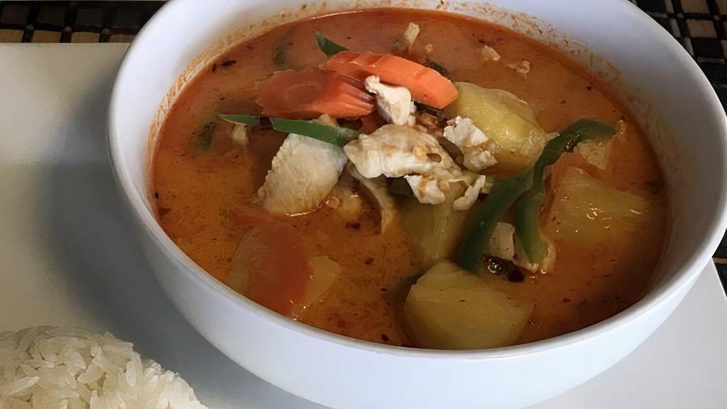 Red Pineapple Curry · A type of red curry with slightly sweet flavor, contain pineapple, carrot, and the protein of choice with a side of steam rice.