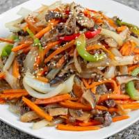 잡채 / Japchae · Korean stir-fried glass noodles with peppers, carrots, onions, beef, and mushrooms.