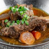 갈비찜 / Korean Braised Beef Short Ribs · Beef short ribs, carrots and radish braised to perfection in a traditional Korean soy sauce ...