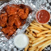Boneless Bufffalo Chicken Wings · Boneless chicken wings, covered with buffalo sauce and french fries, side ranch.