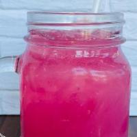 Gentle Witch · A peach-nectarine Red Bull with cherry and blue raspberry syrups, a splash of lemonade and g...