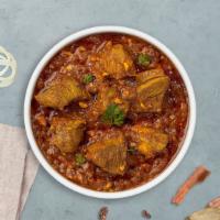 Holla Holla Goat Masala · Tender fresh goat pieces delicately spiced gravy cooked Indian style