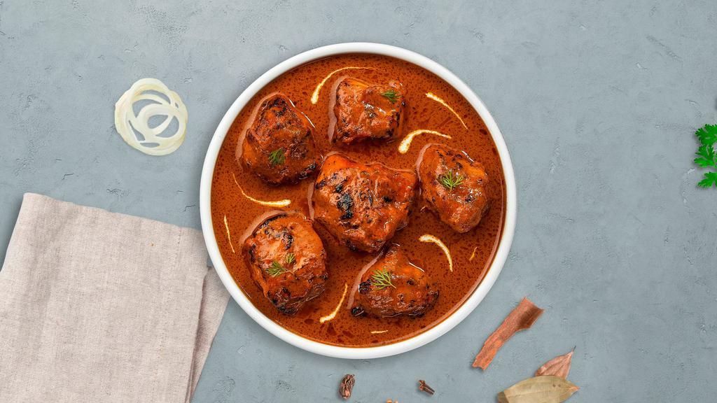Checking In Chicken Tikka · Fresh chicken breasts cooked in a creamy tomato gravy and freshly ground spices.