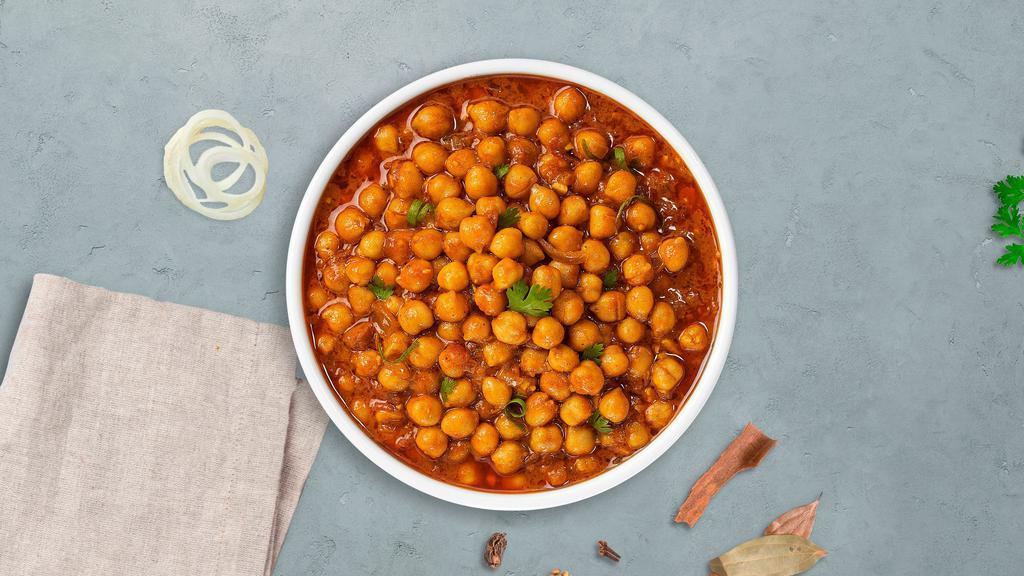Captain Chana Masala · Chickpeas cooked in a tomato and onion gravy with Indian spices.