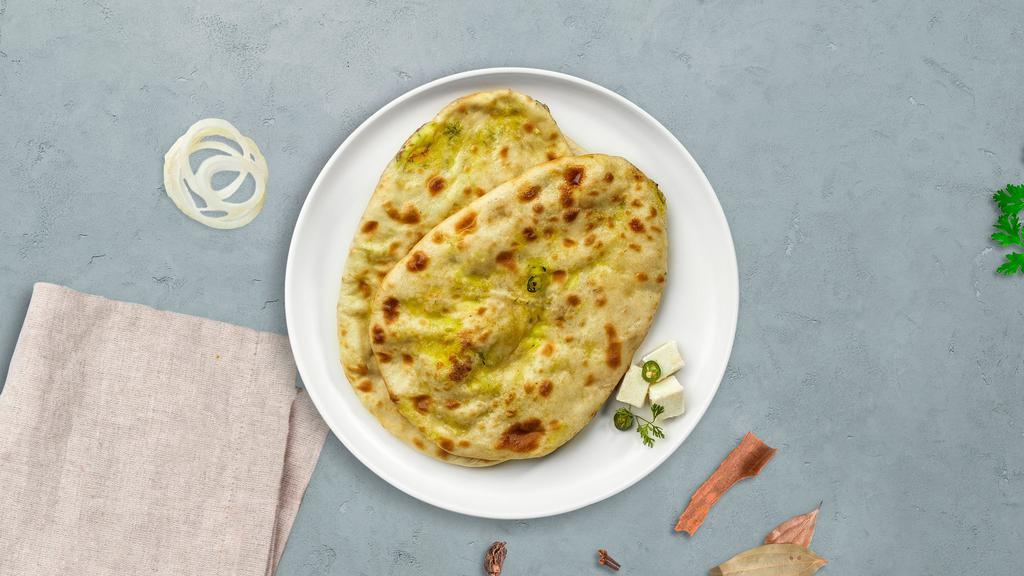 Paneer Dreadful Naan · Freshly baked bread stuffed with cottage cheese cooked in a clay oven