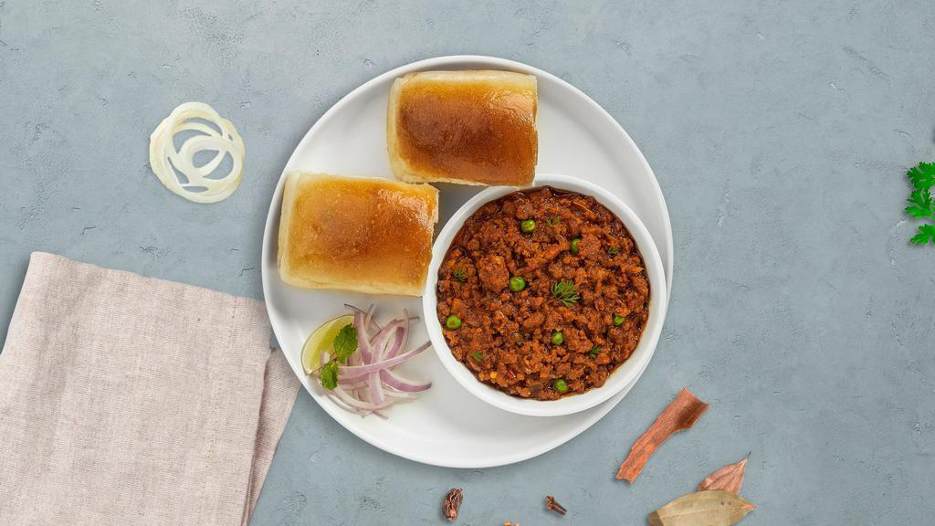 Keema Fine · Freshly baked bread in a clay oven garnished with  ground beef.