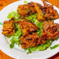 Vegetable Pakora · Vegetable fritters served with tamrind sauce and mint sauce.