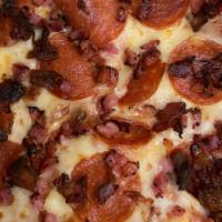 Meat Lover · Pepperoni, Italian sausage, ham, and bacon.
