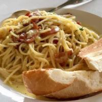 Pasta Carbonara · The classic Italian farmer’s breakfast of spaghetti noodles tossed in a sauce made from egg ...
