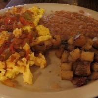 Huevos Rancheros · Two eggs over easy, side of rice and beans, and your choice of tortillas. Topped with green ...