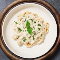 Craft Carbonara Fettuccine  · Classic Italian pasta dish made with eggs, Parmigiano-Reggiano cheese, pancetta, and black p...