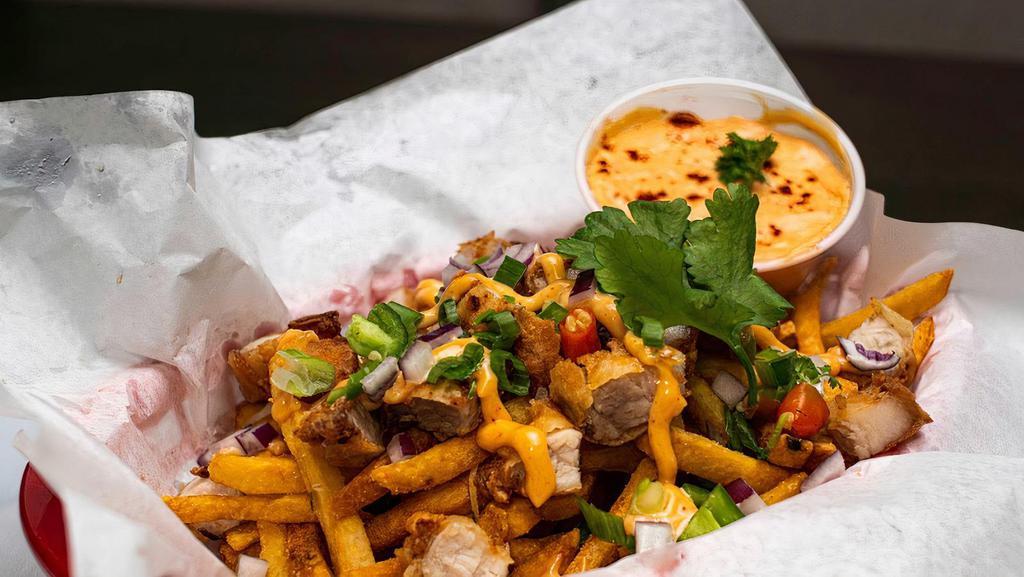 Pork Belly Fries · French fries with pork belly thai chilies. served with creamy sriracha sauce.