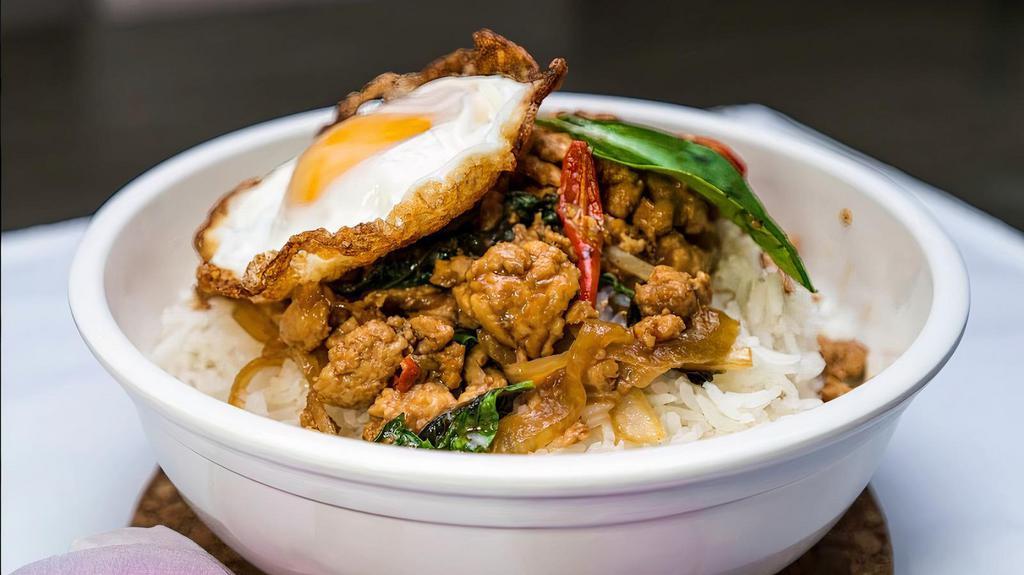Spicy Basil Rice Bowl · Spicy. Ground chicken with bell pepper, onion, authentic basil sauce, topped with a fried egg. Served with jasmine rice.