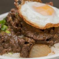 Southeast Asian Steak & Rice Bowl · Stir-fried steak with green onions, topped with a fried egg. Served with jasmine rice.