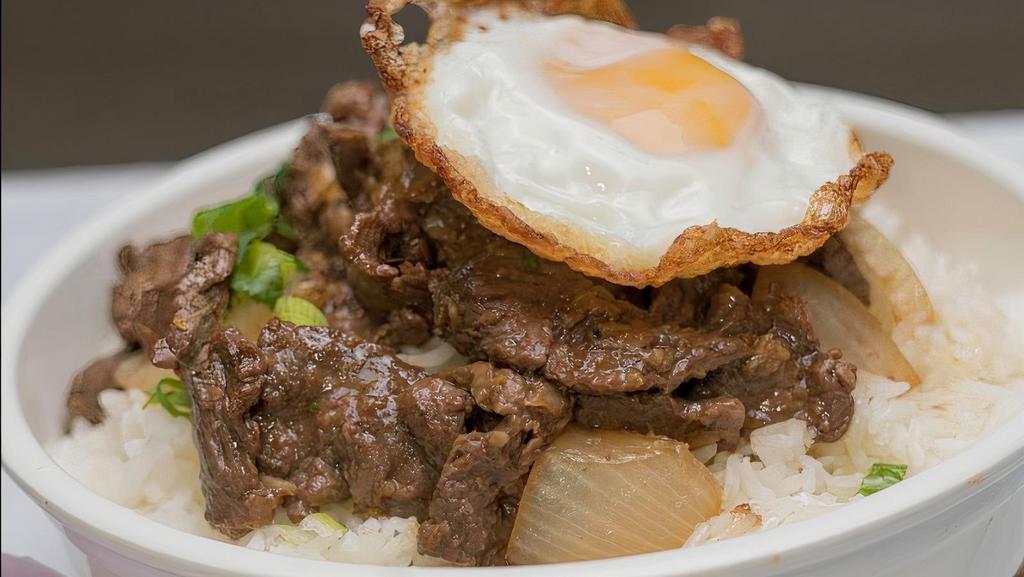 Southeast Asian Steak & Rice Bowl · Stir-fried steak with green onions topped with a fried egg. served with jasmine rice.