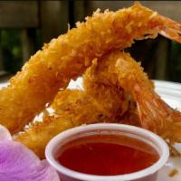 Coconut Shrimp · Fried coconut shrimp with sweet and sour sauce.