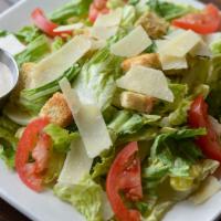 Caesar Salad · Romaine - roma tomato - shaved parmesan - croutons - Caesar dressing.