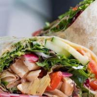 Herbivore Deluxe Wrap · Hummus, mixed greens, tomato, red onion, butternut squash, artichoke hearts, red peppers, cu...