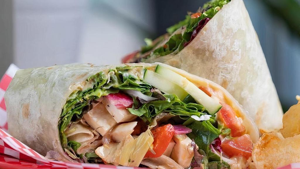 Herbivore Deluxe Wrap · Hummus, mixed greens, tomato, red onion, butternut squash, artichoke hearts, red peppers, cucumber, mozzarella, balsamic reduction.