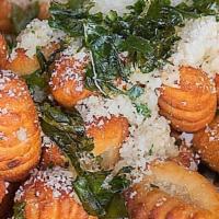 Gnocchi Tots · Vegetarian. Locally made Italian gnocchi, basil, parsley, garlic, parmesan, homemade marinar...