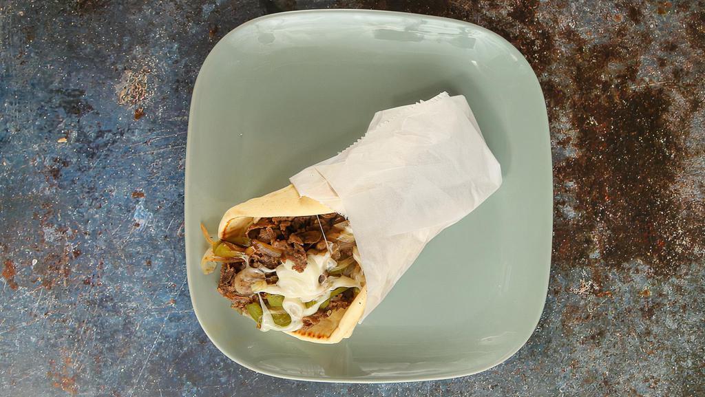 Original Philly Cheesesteak Pita · Original Philly steak grilled, topped with grilled onions, bell peppers, cheese, mushrooms, and choice of sauce.