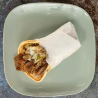 Gyros Philly Pita · Layers of select beef and lamb, perfectly seasoned with zesty spices; broiled on a vertical ...