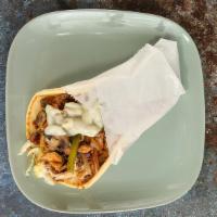 Chicken Shawarma Philly Pita · Chicken breast marinated, topped with topped with shredded lettuce, cheese, grilled onions, ...
