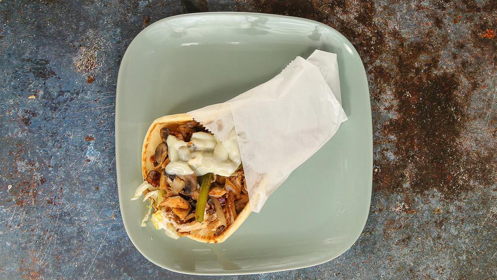 Chicken Shawarma Philly Pita · Chicken breast marinated, topped with topped with shredded lettuce, cheese, grilled onions, mushrooms and bell peppers.
