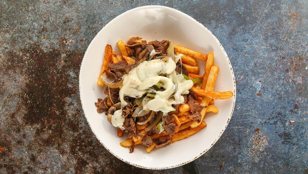 Original Philly Cheesesteak Fries Bowl · Crispy fries, topped with original steak Philly, grilled onions, bell peppers, mushrooms, cheese, and choice of sauce.