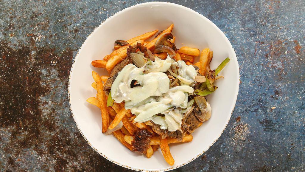 Gyros Fries Philly Bowl · Crispy fries, topped with gyros, grilled onions, bell peppers, mushrooms, cheese, and choice of sauce.