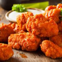 Boneless Wings · Chicken breast nuggets lightly breaded and fried. Served with fries and dipping sauce.