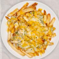 Green Chile Alfredo Fries · A basket of fresh made fries topped with green chile, alfredo and melted jack and cheddar ch...