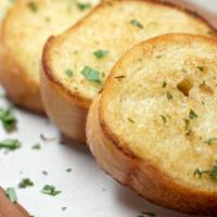 Garlic Toast · Fresh baked, brushed with garlic butter and parmigiano cheese. Served with marinara sauce.