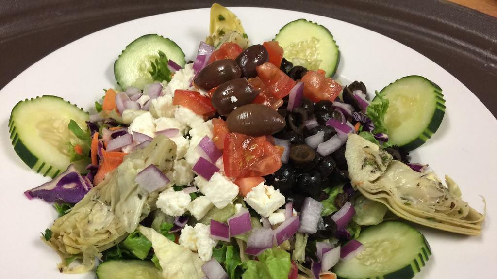 Greek Salad · Feta cheese, kalamata olives, tomatoes,cucumbers, artichoke hearts, pepperoncini and red onions. Served on a bed of mixed greens with Greek herb dressing.