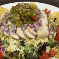 Sante Fe Chicken Salad · Grilled chicken, mixed cheeses, sunflower seeds, red onions, tomatoes, green chile and torti...