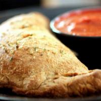 Create Your Own Calzone · Choose up to 3  toppings to create your perfect calzone!