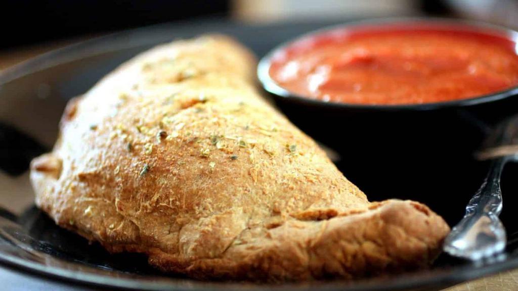 Create Your Own Calzone · Choose up to 3  toppings to create your perfect calzone!