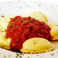 Ravioli · Delicious pasta pillows stuffed with a special blend beef or ricotta cheese and covered with...