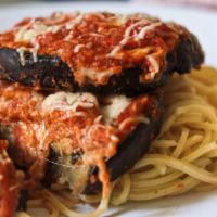 Eggplant Parmigiana · Vegetarian. Fresh eggplant lightly breaded and fried. Topped with marinara sauce and mozzare...