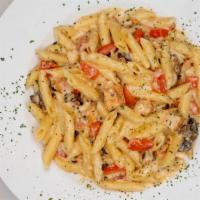Southwest Chicken · Grilled chicken, mushrooms and diced tomatoes tossed with penne pasta in our green chile alf...