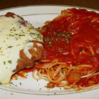 Veal Parmigiana · Breaded veal cutlet baked in marinara sauce and mozzarella cheese. Served with a side of spa...