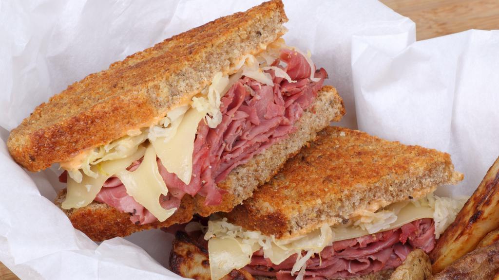 New York Reuben · Hot pastrami, turkey, sauerkraut, and provolone cheese. Served on grilled rye with 1000 island dressing.