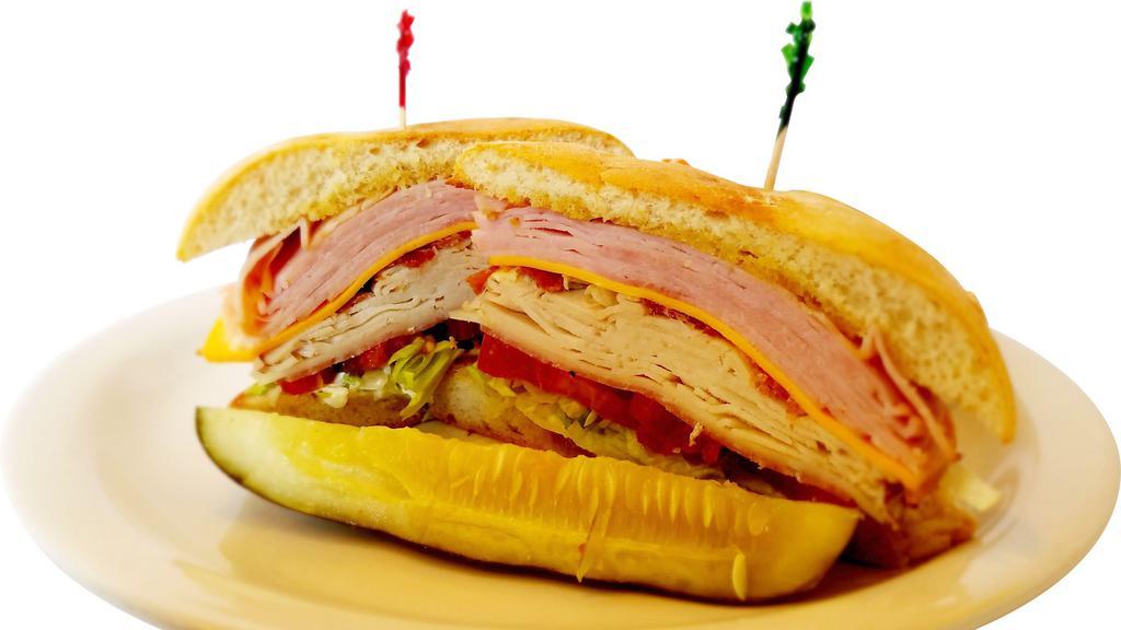 Club House · Ham, salami, turkey, bacon, provolone and American cheeses, lettuce, tomato and mayo on ciabatta.