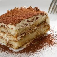 Tiramisu · Made with mascarpone cheese, lady fingers, espresso, a touch of liqueur, and dusted with cho...