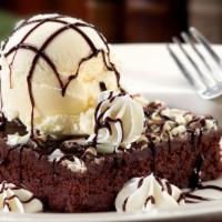 Hot Fudge Brownie Sundae · Our hot fudge brownie topped with a generous scoop of vanilla gelato, hot fudge, whipped cre...