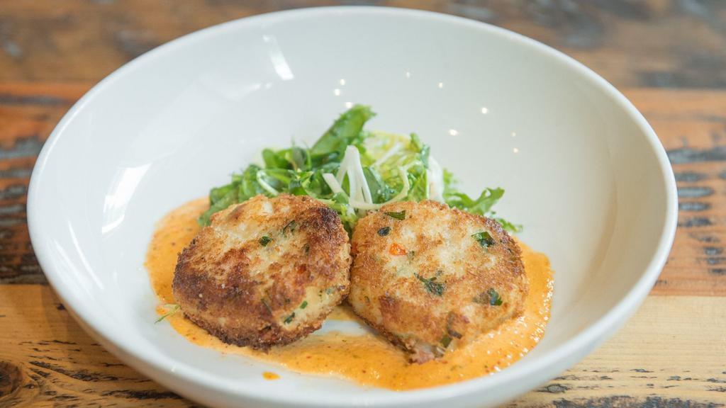 Dungeness Crab Cakes · shaved fennel and granny smith apple slaw, champagne vinaigrette, spicy remoulade, fines herbs