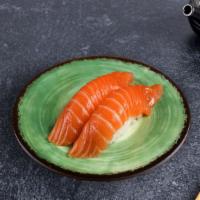 Tuna Nigiri · Slice of tuna over rice. (2 Pieces).