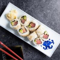 Spicy Tuna Roll · spicy tuna with goba and cucumber inside with smelt eggs on top.