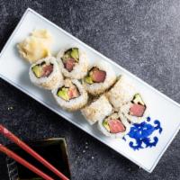 Crazy Roll · Spicy tuna inside with spicy yellow tail, sriracha sauce, and green onions on top.