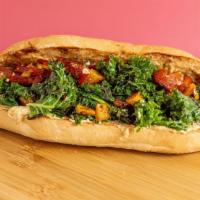 The Veggie Sandwich · Vegan. Garlic kale, butternut squash, roasted peppers, hummus, balsamic glaze and French roll.